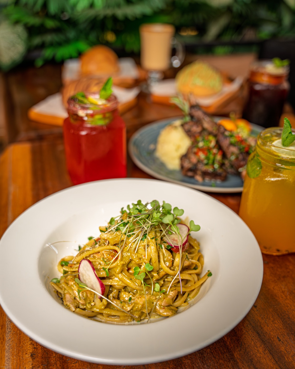 Pasta and drinks spread across the table
