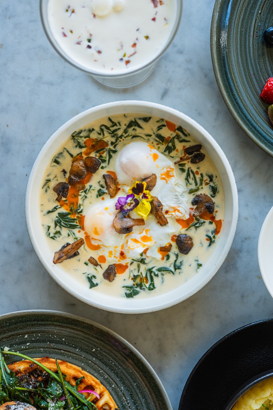 Poached eggs with herbs and chilli oil