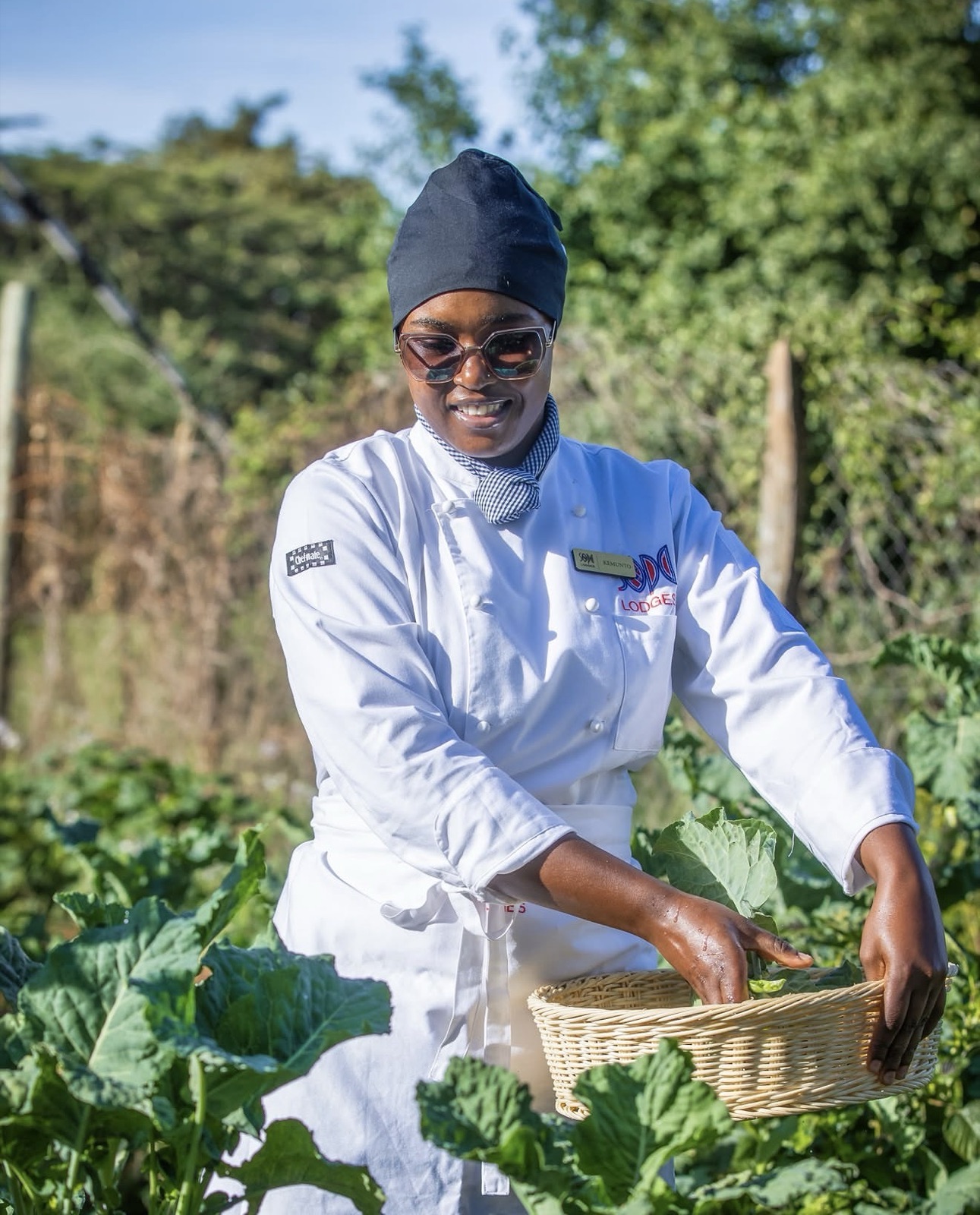 Chef gathering produce in the kitchen garden